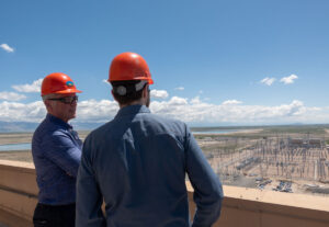 Members of the R6 Listening Tour discussing the powerlines visible from the roof of the IPP.