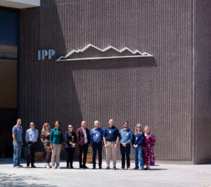 Group photo of R6 listening tour posing outside the IPP building.