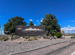 Intermountain Power Plant Sign against a blue sky.