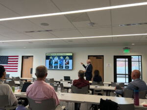 Mike Masquelier presenting to several county commissions and other leaders at the R6 Growth Summit in Richfield, Utah, on May 6.