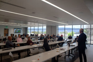 Mike Masquelier presents to several county commissions and other leaders at the R6 Growth Summit in Richfield, Utah, on May 6.