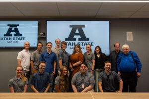 Group photo with students from ASPIRE and ASPIRE faculty member and USU's Director of Institute of Government and Politics Jennifer Seelig.