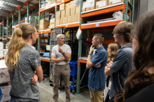 Thierry Cuassat, the Chief Technology Office at Lion Energy, explaining the product testing system to ASPIRE students.