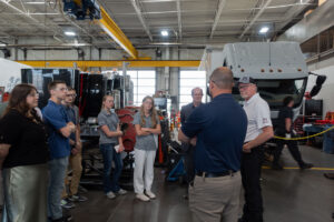Students from ASPIRE gather in front of Utah's first Class 6 Box Truck to listen more about it.