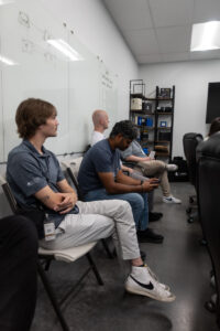 Students listening to presentation at Lion Energy.