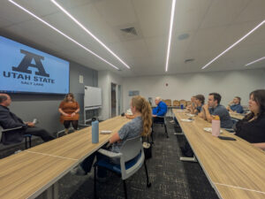 ASPIRE Lunch and Learn event with Jennifer Seelig, with students listening intently.