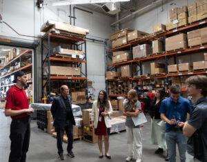 ASPIRE students learn about the storage section of the parts store at Kenworth Sales.