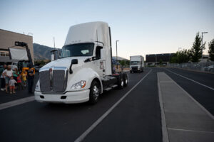 The Class 6 and Class 8 electrified trucks on the track outside the EVR at the Open House.