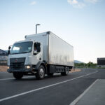 The first in-motion charging Class 6 box truck makes its way around the track outside the EVR.