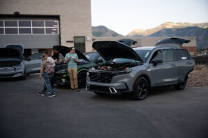 Guests observe the EVs on display outside the EVR at the Open House on July 17.