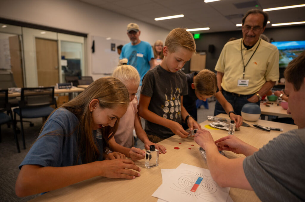 Children learn the exciting scientific principles surrounding magnetism, with help from an ASPIRE engineering student.