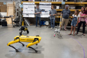 Three dancing robots fascinate guests at the ASPIRE Open House.