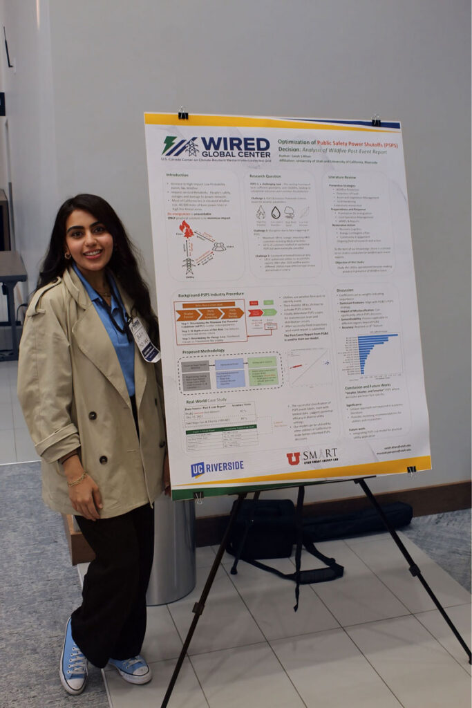 Sarah Sami Khan standing next to her research poster at the 2024 WIRED Symposium.