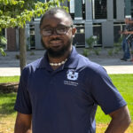 Picture of Foeday wearing a USU polo.