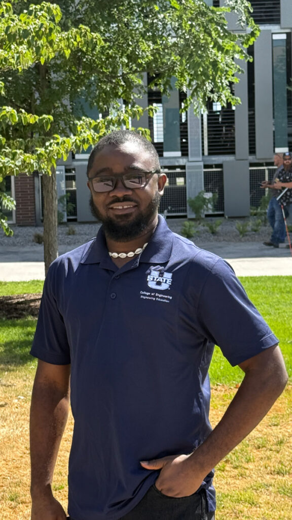 Picture of Foeday wearing a USU polo.