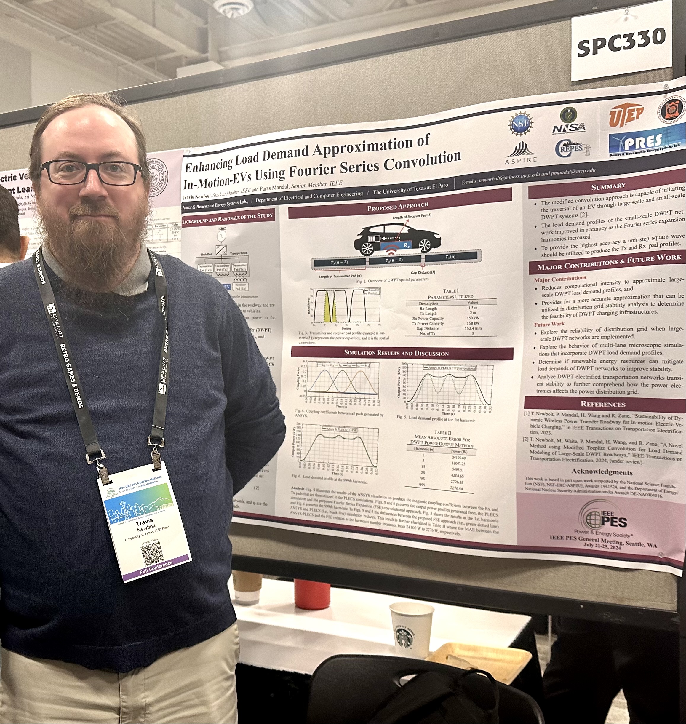 Travis Newbolt and Paras Mandal next to their poster at the conference.