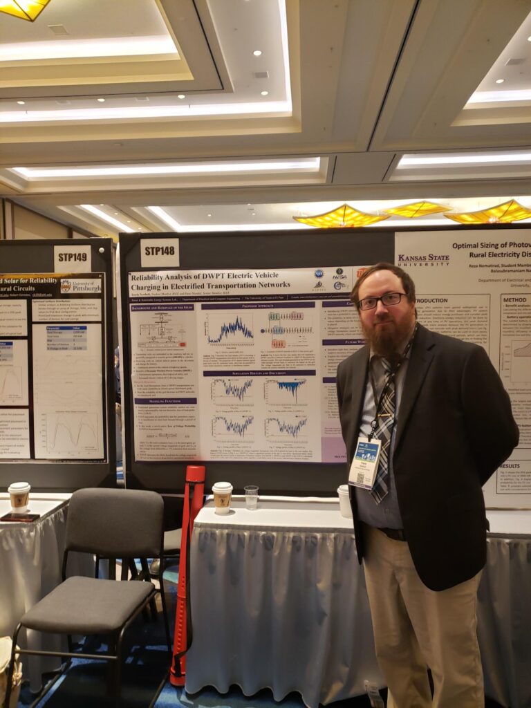 Travis Newbolt and Paras Mandal next to their poster at the conference.
