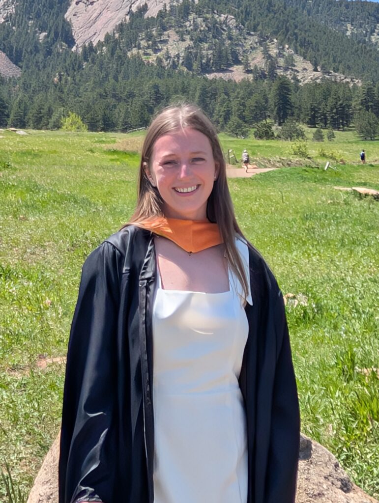 MiKyla smiling in her graduation gown.
