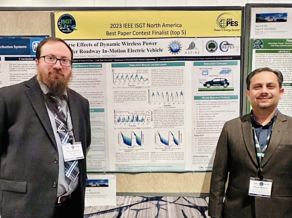 Travis Newbolt and Paras Mandal next to their poster at the conference.