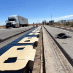 Truck driving next to the ASPIRE Electreon DWPT system at the Utah Inland Port.