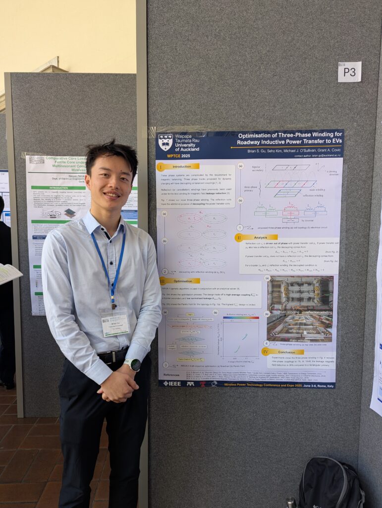 Brian Gu standing next to his research poster.