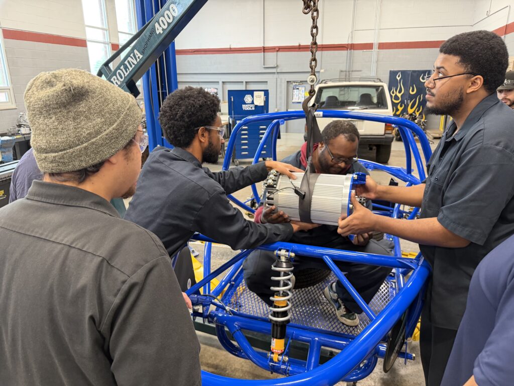 Students at Bluegrass College installing electric motor in the Kit car from Switch Vehicles' Switch Labs program.