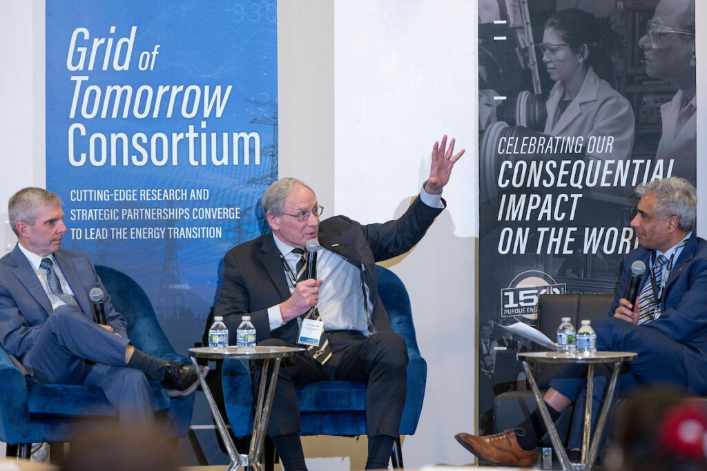Discussion between three panel leaders at the Grid of Tomorrow Consortium.
