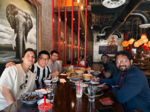 Students pose for a photo after a dinner together as a part of the ASPIRE Student Cohort trip.