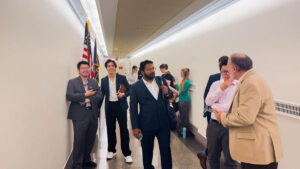 ASPIRE Student Cohort trip waiting in the hallway to meet with a legislator.