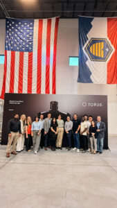 ASPIRE Student Cohort trip pose for a group photo at Torus.